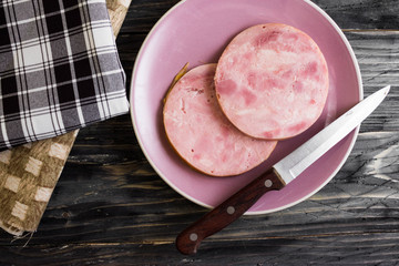Ham on a wooden table in rustic style