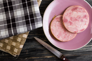 Ham on a wooden table in rustic style