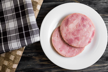 Ham on a wooden table in rustic style