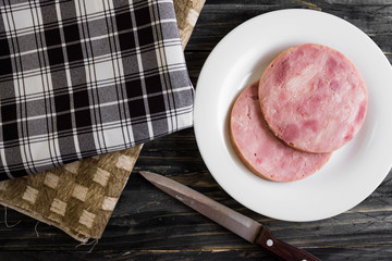 Ham on a wooden table in rustic style