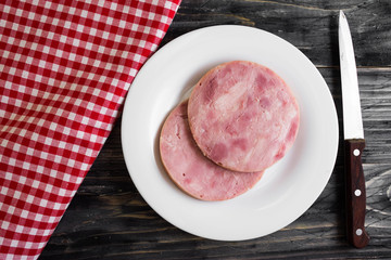 Ham on a wooden table in rustic style