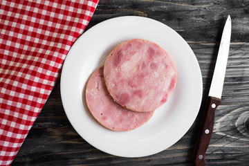 Ham on a wooden table in rustic style