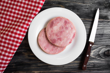 Ham on a wooden table in rustic style