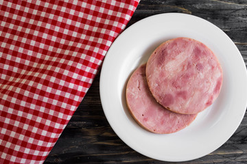 Ham on a wooden table in rustic style