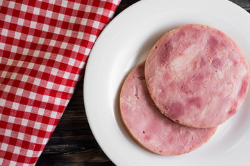 Ham on a wooden table in rustic style