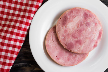 Ham on a wooden table in rustic style