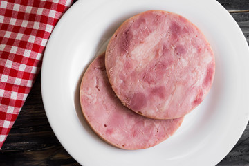 Ham on a wooden table in rustic style