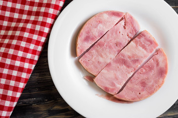 Ham on a wooden table in rustic style