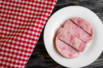 Ham on a wooden table in rustic style