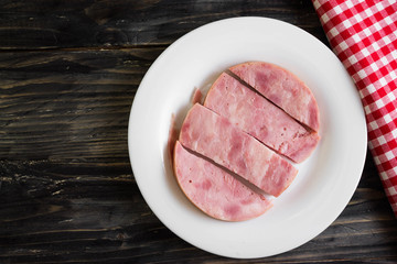 Ham on a wooden table in rustic style