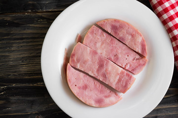 Ham on a wooden table in rustic style