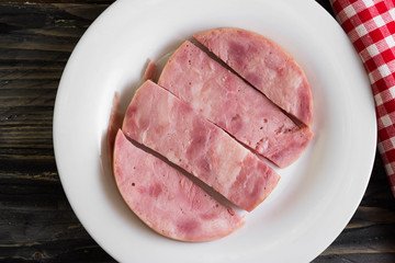 Ham on a wooden table in rustic style