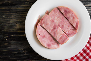 Ham on a wooden table in rustic style