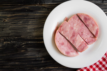 Ham on a wooden table in rustic style