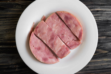 Ham on a wooden table in rustic style