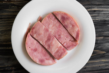 Ham on a wooden table in rustic style