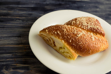 Austrian strudel with lemon and orange jam on a wooden table in rustic style