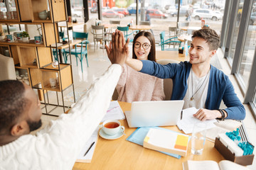 International students giving high five