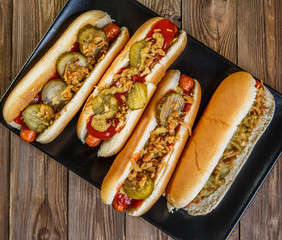 American hot dog with pickles,onions, ketchup and mustard