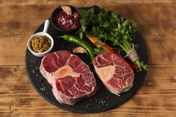 raw fresh meat on the bone cut  Osso Buco on board