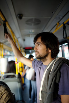 The young bearded man in the city bus.