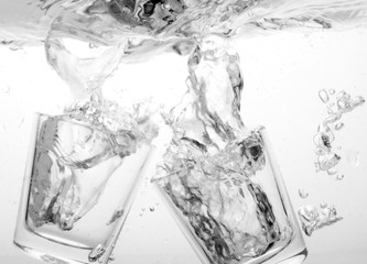 Dish washer, kitchen items in the water and bubbles