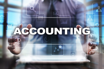 Fototapeta na wymiar Businessman using tablet pc and selecting accounting.