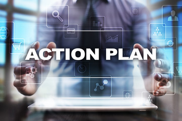 Businessman using tablet pc and selecting action plan.