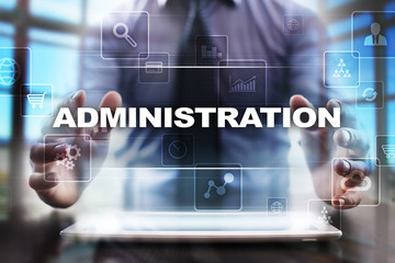 Businessman using tablet pc and selecting administration.