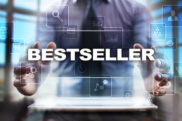 Naklejka na ściany i meble Businessman using tablet pc and selecting bestseller.