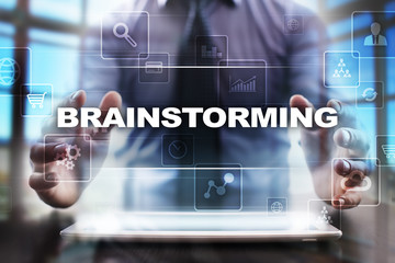 Businessman using tablet pc and selecting brainstorming.