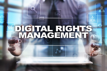 Fototapeta na wymiar Businessman using tablet pc and selecting digital rights management.
