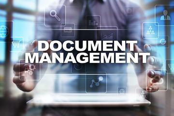 Fototapeta na wymiar Businessman using tablet pc and selecting document management.