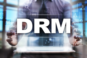 Businessman using tablet pc and selecting drm.