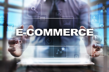 Businessman using tablet pc and selecting e-commerce.