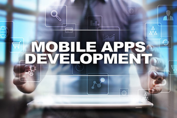 Businessman using tablet pc and selecting mobile apps development.