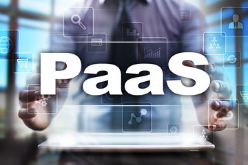 Businessman using tablet pc and selecting paas.