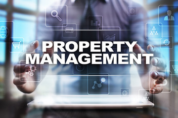 Businessman using tablet pc and selecting property management.
