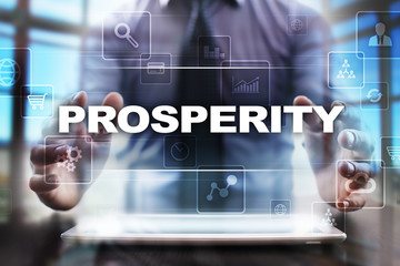 Fototapeta na wymiar Businessman using tablet pc and selecting prosperity.