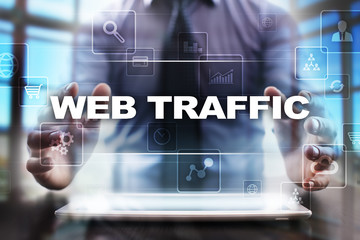 Businessman using tablet pc and selecting web traffic.