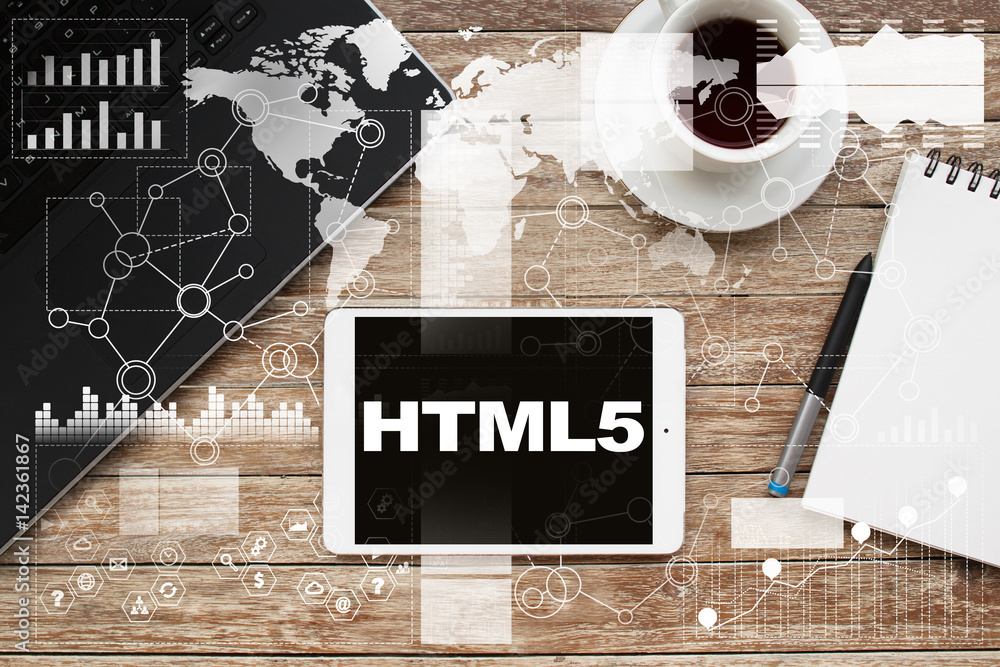 Aufkleber tablet on desktop with html5 text.