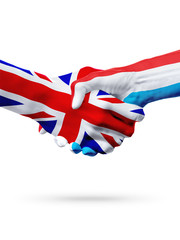 Fototapeta premium Flags United Kingdom, Luxembourg countries, partnership friendship handshake concept.