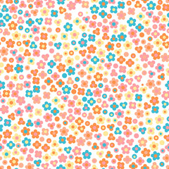 Floral seamless pattern. Small cute simple flowers. Green background.