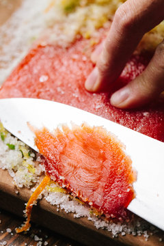 Slicing cured salmon 