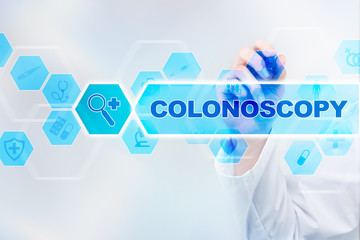 Fototapeta na wymiar Medical doctor drawing colonoscopy on the virtual screen.