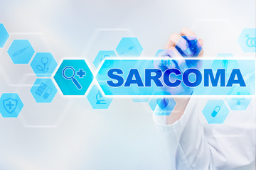 Medical doctor drawing sarcoma on the virtual screen.