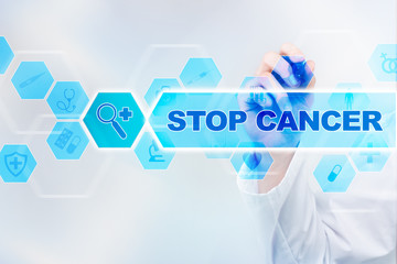 Fototapeta na wymiar Medical doctor drawing stop cancer on the virtual screen.