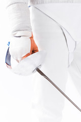 partial view of fencer in uniform holding rapier in hand on white