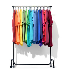 Mobile rack with color clothes on white background. File contains a path to isolation