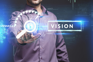 Business, Technology, Internet and network concept. Young businessman working on a virtual screen of the future and sees the inscription: Vision